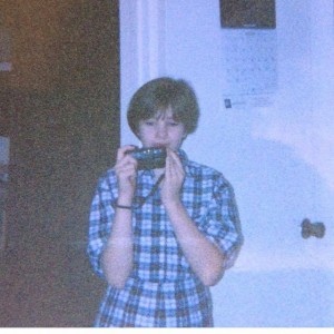 Sarah with her camera at 10 years old